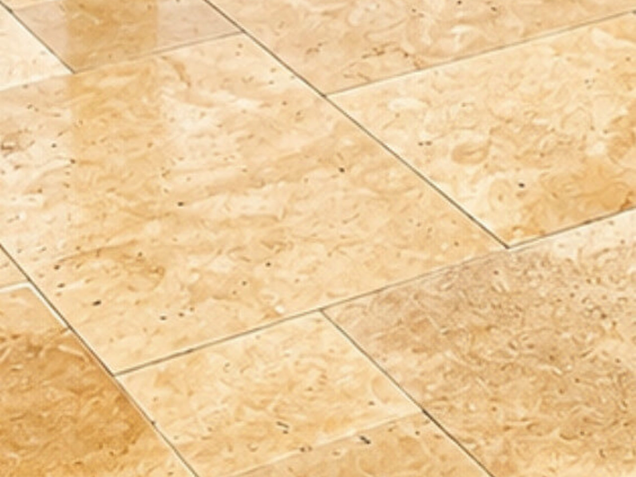 Ivory travertine pool deck pavers with a polished, variegated finish