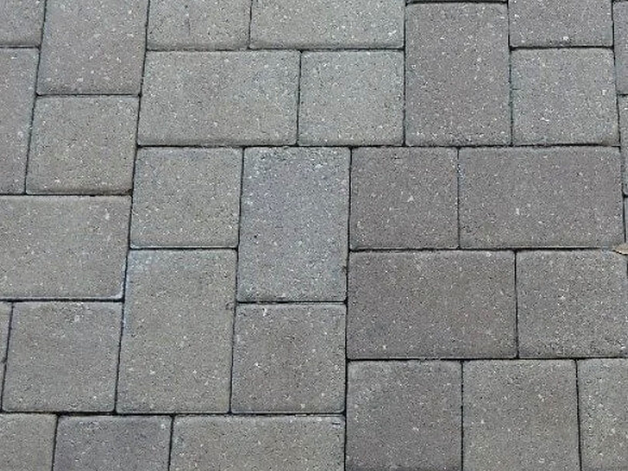 Modular gray concrete pavers with tight sand joints, a Boynton Beach patio material option